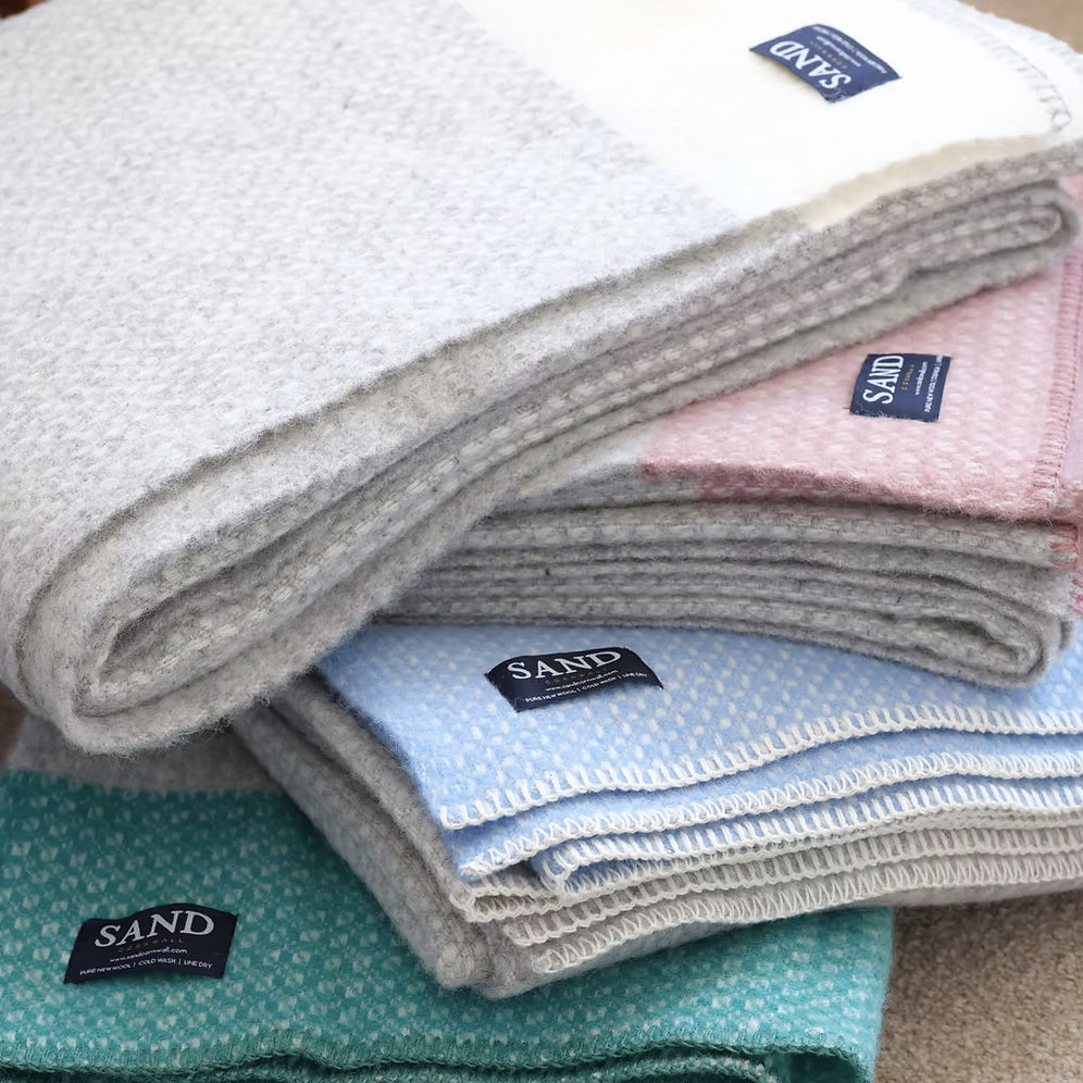 Crossweave Sea Blue Pure New Wool Blanket Throw with light grey base and bright blue stripe, folded neatly.