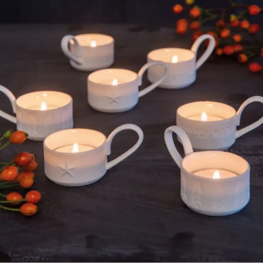 Räder Little Light Fir Trees tealight holder in glazed and unglazed porcelain with engraved Christmas tree pattern.