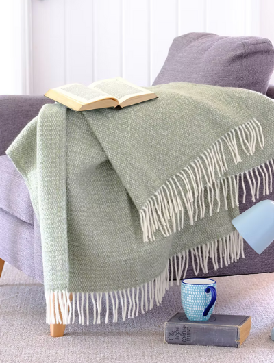 Green and grey pure new wool blanket Throw with circular weave and cream tassels, Sand Cornwall