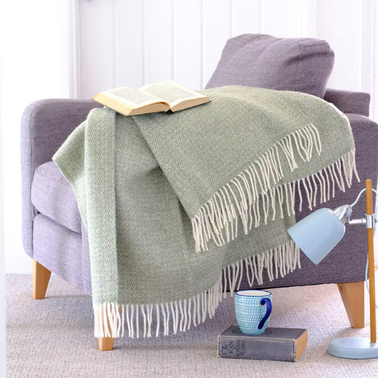 Green and grey pure new wool blanket Throw with circular weave and cream tassels, Sand Cornwall