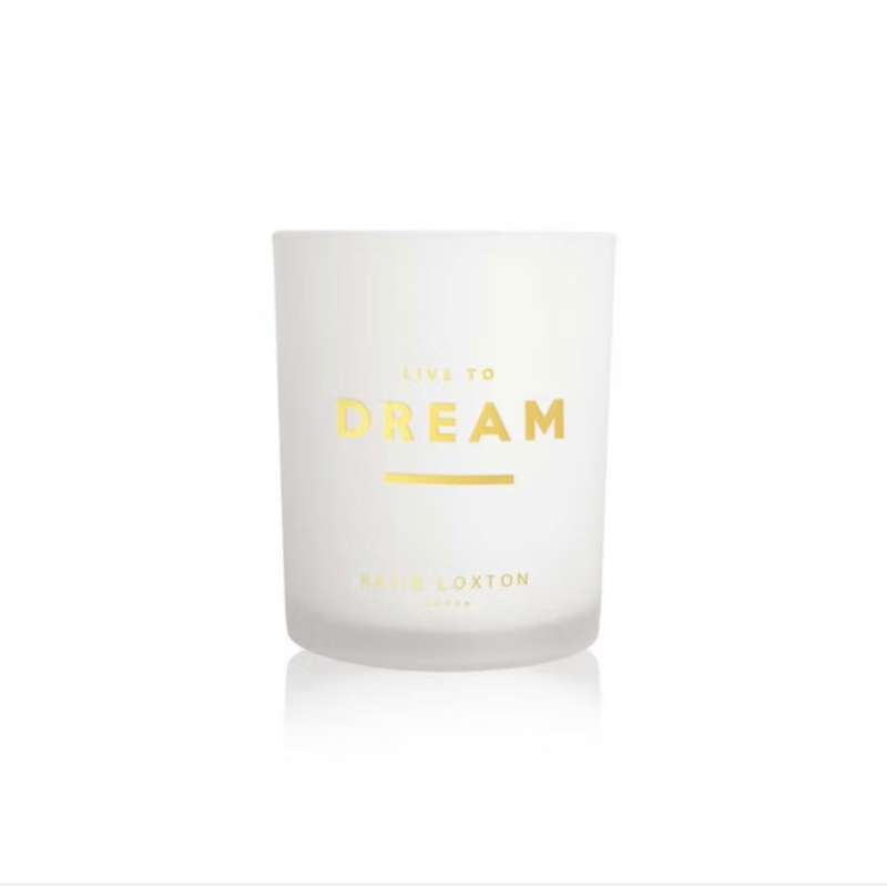 Katie Loxton Sentiment Candle in glass jar with ‘Live To Dream’ message, white orchid and soft cotton fragrance.
