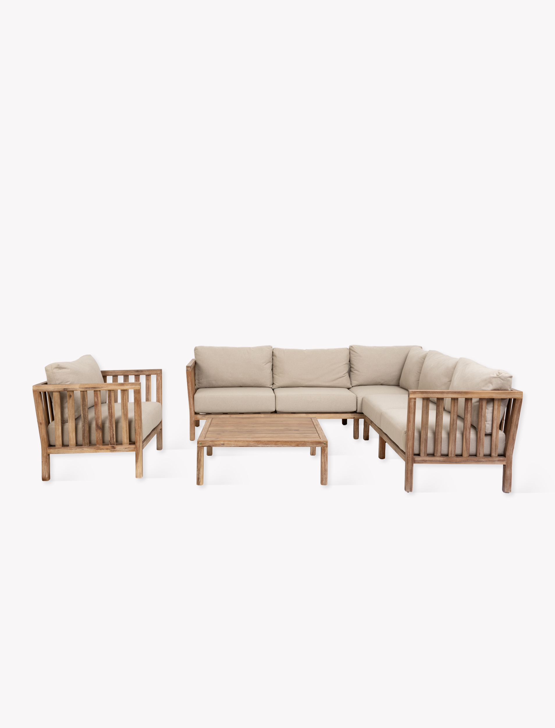 Garden Trading Porthallow Dark Natural acacia corner sofa set with matching armchair and coffee table on a garden patio. Sizes
